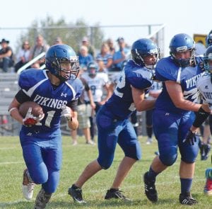 Frankie Miller and Billy Hackett made sure no one got their hands on Rory Bakke who ran unimpeded around the corner for a big gain. Bakke rushed for 105 yards against Mesabi Academy.