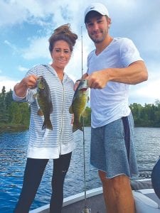 Sister and brother Becca and Doug Haugan of Orono, Minnesota, had a great day on the water with Joe Carlson of Joe’s Inland Fishing while their parents went golfing. Joe took the siblings out years ago when Becca was so small she doesn’t remember that trip. They caught these two bass in a “double,” their lines hitting at the same time right after arriving at their fishing spot. They also caught a nice 23-inch walleye.