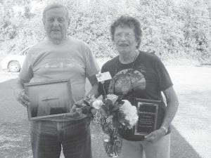 Bob and Eddie Hertzberg with their gifts for volunteering for the ENP. They received fresh flowers, a picture of “Pete’s Island” taken by our own Dido Swader and a plaque of appreciation.