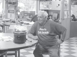 Bill Hackett resting after grilling all the meat at the Grand Portage ENP Volunteer Appreciation BBQ. He was recognized at the event with a plaque of appreciation.