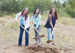 Cascade Vacation Rentals senior staff Rental Manager Tala Marxen, Operations Manager Katterine Payer and Accountant/Office Manager Sarena Nelson took part in the recent ground breaking ceremony for a new company campus being built to offer employee housing and more office space.