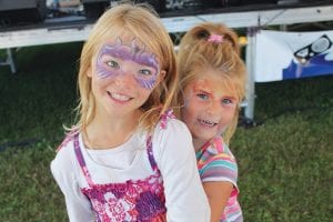 Above: Kids enjoyed dancing—and having their faces painted! Right: Dancers Annie and Mike DeBevec took a spin on the dance floor during the wonderful Clearwater Hot Club set.