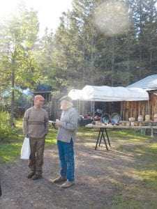 The popular Crossing Borders Tour will mark its 19th year Sept. 25 through Oct. 4, with host studios from Two Harbors to Grand Portage. Dick Cooter of Cooter Pottery and Hand Weaving in Two Harbors is shown here talking to a visitor during last year’s event.