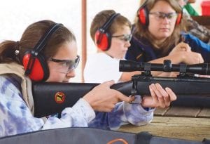 Photos courtesy of MN Deer Hunters Association, Arrowhead Chapter The Minnesota Deer Hunters Association sponsors Forkhorn Camps. Left: At camp, youths earn firearms safety certification. Top: Other skills, such as orienteering are practiced. Above: A favorite Forkhorn Camp activity is archery.