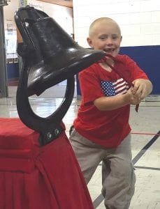 A fun tradition at Birch Grove Community School is ringing in the new school year. Every student gets to ring the heavy iron bell. Little Rolan was all smiles when it was his turn.