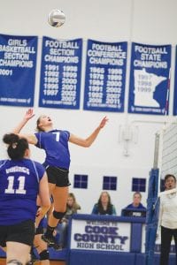 Far left: With more than a little bit of aggression Linden Sutton (No. 7) went up high to spike this ball across the net in the Vikings’ game against Moose Lake/Willow River. Above: As Raina Ryden looked on intently, Lily Gruber-Schulz made a nice play on the ball and bumped it to the front row. Left: Using perfect form, Jordyn Deschampe (No. 4) made a nice play to control the ball and set it to a teammate at mid court.