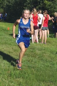 The Viking varsity girls earned 4th place at the Eveleth meet on September 17. Left: Ruby Walsberg was the second Viking runner on the winning junior varsity cross country team. Above left: Just an eighth grader, Noah Smith finished 13th overall in the boys' varsity cross country race at Eveleth. Above right: Kate Walsberg finished 39th for the Viking girls’ varsity team.