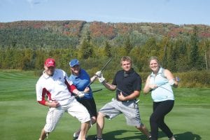 When they stopped to get this fun photo taken, the loveable team from the Grand Marais State Bank had no idea that they would win the North Shore Health Care Foundation golf scramble. (L-R) Mark Youngdahl, Samantha Wallner, Seth Williams, and Stephanie Radloff. See more golf scramble photos on page B8.