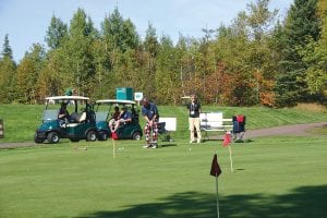 Sporting checkered golf pants, Greg Gresczyk attempted to make a putt in the putting contest at the North Shore Health Care Foundation fundraiser held on Sunday, September 27. The contest is held to make money for the North Shore Health Care Foundation. Gresczyk’s putt slid just by the hole on his attempt