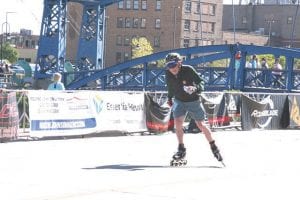 A smiling Bill Blank skated his way to the finish line of the NorthShore Inline Marathon. The Lutsen native has competed in all 20 of the NorthShore races, making him a model of consistency.