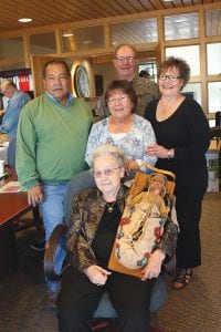 Above left: The Grand Portage Tribal Council happily accepted a donation from the Wojtysiak and Lunke family on Friday, October 9. The 140-piece collection consists of many beautiful items created by Grand Portage community members through the years, such as the tikinagan that Iola Wojtysiak is holding. With Iola is (L-R) Grand Portage Tribal Chair Norman Deschampe, Grand Portage Museum Director MaryAnn Gagnon, Orvis Lunke, Donna Lunke.