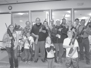 Left: There were a lot of happy gun winners at the Minnesota Deer Hunters Association Arrowhead Chapter event on Saturday, October 10 at the Cook County Community Center. (L-R) MaeAnna LaFavor, Tristan Olson (with his dad Randy Olson behind him), Brandon Deschampe Morrison, Jordan Porter, Kurt Steele, Guy Sifferath, Scott Houglum, Kathy Bernier, John Pearson, Orvis Lunke. In front are Kalli Anderson and Kole Anderson.