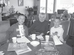 Students in Jana Larson’s 4th grade class are enjoying time spent at the Cook County Senior Center, reading to adults. Enjoying popcorn and some good books were Ethan Tate, Mary Sanders and Brayden Schmidt.