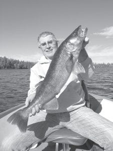 Above: John Torrens of Petaluma, California caught this beautiful 30- inch walleye on Saganaga Lake on October 11 while fishing with guide Cory Christianson. Torrens said catching the big walleye was the “thrill of my life.” The fish was released.