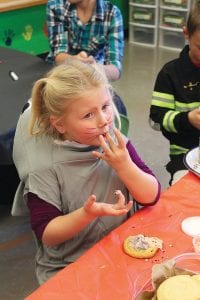 The Birch Grove Community School once again hosted a fabulous Halloween carnival on Sunday, October 25. Linda, dressed as a notso scary shark, enjoyed decorating her cookie, sticky fingers and all.