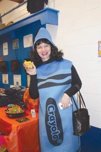 Left: Birch Grove Community School Director Caroline Wood added more color to the event with her Crayola costume. Above: In addition to artistic cakes, community members put their imaginations to work in the pumpkin carving contest. There were many unique and interesting gourds.