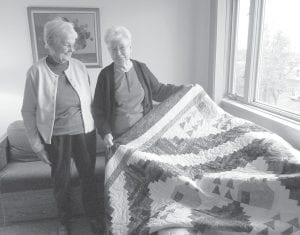 Care Partners of Cook County is pleased to announce that Lori (Delores) Thompson of Grand Marais (on right) is the winner of the organization’s quilt raffle. Presenting the quilt to Lori is Care Partners volunteer Carol Harris, who made the beautiful queen-size quilt. Care Partner Director Kay Grindland expressed appreciation to Drury Lane Books for displaying the quilt and to Buck’s Hardware, Crystal’s Quilt Shop, Odds & Endz, Lake Superior Trading Post, Java Moose, Joynes Ben Franklin and Care Partners volunteers for helping to sell tickets. Care Partners raised over $1,600 to support their work with those on the journey of aging and serious illness.