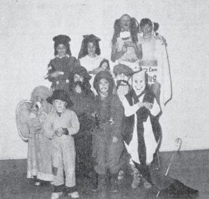 A Halloween costume party was held in October 1974 at Sawtooth Mountain Elementary School prior to the class Halloween parties. The winners, as judged for most original costumes, are from left, Jeremy Bowen, elephant, grade 1; Ted Flack, hobo, kindergarten; Susan Durham, old man, grade 5; Tina Voce, soldier, grade 4; Adam Nelson, hobo, grade 3; Tali Nelson, clown, grade 2. In back row are Lori Everson and Terri Genedak, Raggedy Ann and Andy, grade 6; and Lisa Wilson and Kathy Johnson, babies, grade 6.