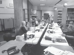 Cook County commissioners were among the nearly 100 officials who gathered in Grand Portage for four days of cross-border emergency training. At the end of training, representatives from various agencies and organizations participated in a simulated disaster exercise. Here the commissioners, along with key county staff members, standby the phones as they would in a real-life catastrophic event.