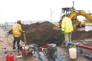 A water main break near the East Bay Suites had Grand Marais Public Utilities crews working overtime to get it fixed on November 4. Several pumps had to be used to keep the hole as water free as possible so the main could be repaired.