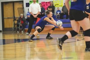 Above: Senior outside hitter Linden Sutton also plays a mean back row. Here she goes low to bump a serve to her front line in the game played against Wrenshall.