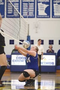 Above: Senior Maddy Roy made a great play on this spike in the Section 7A semi-final game against the Wrens. Left: Junior Tarin Hanson made a nice set assist on this ball.