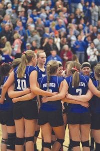 During a break between games the team locked arms in unity and gathered around Coach Taylor (just out of the picture) to hear her words of encouragement and coaching instructions.