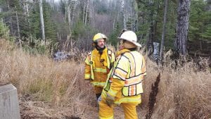 A motorist swerved to avoid a deer, left the roadway and went down a steep embankment off Highway 61 near Horseshoe Bay in Hovland. The man suffered non-life threatening injuries and was transported to North Shore Hospital. Hovland and Colvill firefighters and First Responders assisted at the scene. Incident Commander Joe Peterson of Hovland and Assistant Hovland Fire Chief Terry Spieker await the tow trucks to get the truck out of the ravine.