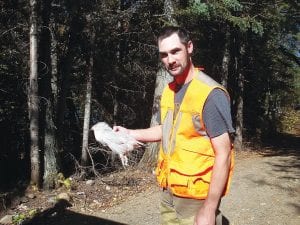 Above: Andy Porupsky had a very interesting day of grouse hunting in the Hovland area on October 11. He bagged this albino grouse! Right: Compared to a normally colored ruffed grouse, you can see the silvery feathers on this bird. Porupsky plans to have the unusual grouse mounted.