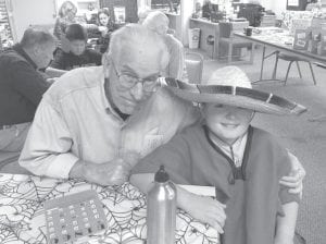 In addition to reading and talking about Halloween costume choices, seniors and students enjoyed playing bingo.