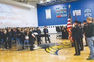 The Cook County High School Band and American Legion Honor Guard stood respectfully as the High School Choir sang the national anthem.