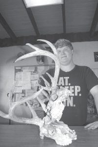 Ricky Meacham of Warrens, Wisconsin came north to hunt deer with his father and found the remains of two bucks who locked horns forever. Meacham will have this unusual find mounted with a clear finish coating to preserve it.