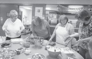 Elders had a lot of fun preparing for Halloween. Choosing the best adornments for Halloween cakes are (L-R) Debbie Corcoran, Hattie Pepion, Valita Bockovich, Carrie Newman.