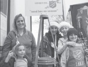 The Cook County News-Herald December 29, 2003 caption declares, “Ringing the bell at the Salvation Army donation kettles can be fun as ‘Palmers and friends’ found out.” Singing and playing instruments at the Salvation Army Red Kettle at Gene’s Foods were (L-R) Carolina Palmer (front), Virginia Palmer, Michelle Weitz, Carly Puch, and Lexie Palmer.