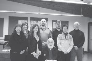 Several key contributors to the Industrial Arts Shop gather to celebrate its completion. (L-R) Superintendent Beth Schwarz, School Board Chair Jeanne Anderson, School Board Member Sissy Lunde, Industrial Arts Instructor Peter Johnson, Leonard Sobanja, (seated), School Maintenance Supervisor Tom Nelson, Ruth Drake of Boldt, and School Board Member Chris Goettl.