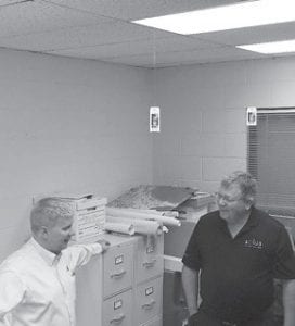 Keith Butcher, energy services representative for Southern Minnesota Municipal Power Agency (SMMPA), the power provider for Grand Marais Public Utility Commission) discusses commercial lighting with Jim Azure of Solus LED.