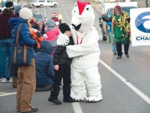 The Sivertson Gallery polar bear handed out hugs to parade watchers.