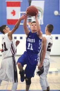 Left: Speedy senior guard Rory Bakke split the defenders to score two points against the Two Harbors Agates. Above: Sweet shooting Dyami Blackwell has been a big surprise for the Vikings. The freshman scored 19 points against Silver Bay and 10 points against Two Harbors.