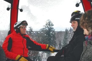 Riding the new gondola for the first time, the group enjoys the great view as the car makes its way to the top of Moose Mountain.