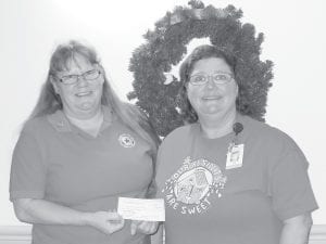 The North Shore Care Center expresses thanks to the many community members who have supported seniors in so many ways, including the American Legion Post 413 Auxiliary. Auxiliary member Wendy Ford presents a donation of $400 to Nora Bockovich of the Care Center Activity Department.