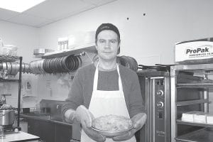 Rain Elfvin, six-month owner of Elfvin Bakery, and one of his delicious creations.