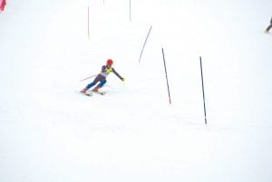 Above: Tri Captain Haley Yoki from Silver Bay lights up the Slalom course at the Hibbing Invite. Top: Ezra Lunde battled a headwall that was really rutted up and completed a solid race at Giants Ridge on January 7.