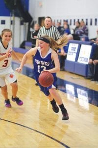 Hannah Toftey (13) made a quick move, surprising her smiling defender and leaving her in the dust as she cut to the basket.