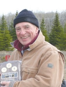 Above: Richard “Dick” Parker’s hard work for the Gunflint Mail Run is recognized by a new award meant to honor similar efforts by volunteers. Left: Rick Johnson was presented with this year’s inaugural award.