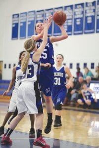 Left: Bayley Cox eluded her Silver Bay defender to go up and score two points against the Mariners.