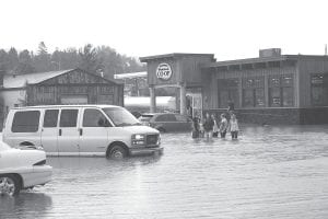 The Grand Marais Municipal Parking Lot on South Broadway has long been susceptible to flooding following heavy rainstorms, as seen in this July 19, 2013 photo. City councilors, along with the Cook County Chamber of Commerce, have begun looking for solutions.