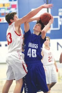 The future is now for Vikings’ basketball with more and more freshman seeing varsity playing time. Here, in the game against Ely, three freshmen saw plenty of playing time. Upper left: Will Ramberg (40) works hard to evade a block. Above: Dyami Blackwell (44) beat his man to the bucket to score two of his four points in the game. Left: Trusen Gordon, below, shows off his considerable ball handler skills.