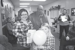 Thirty-five nonprofits received financial support from the 1st & 2nd Thrift Store, thanks to volunteers who logged hours in the store. Checks were distributed during a celebration at the Cook County Senior Center on Wednesday, January 27. Council on Aging board member Walt Mianowski presented the checks. Here, Sarah Somnis and her daughter, Lynda, accept a check for Birch Grove Community School.