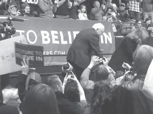 Dressed somewhat casually in a simple jacket and no tie, Presidential candidate Bernie Sanders made quite an impression on the crowd at the DECC on Tuesday, January 26 with his speech on a future to believe in.