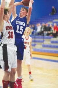 Leif Anderson is one of a half dozen talented freshmen getting playing time on the varsity this year. Despite the attempted block, Anderson got this two-point shot attempt off in the Vikings’ game against Mesabi East.